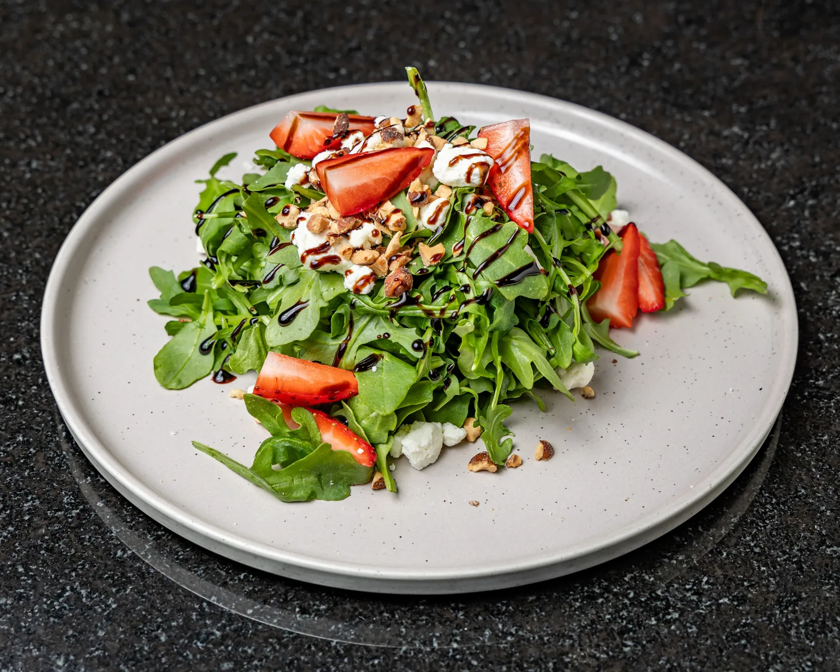 Arugula, strawberry and goat cheese salad, plated