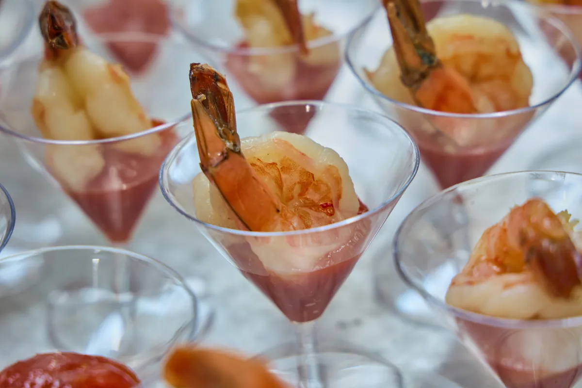 Individual shrimp cocktails served at an NTK catered event
